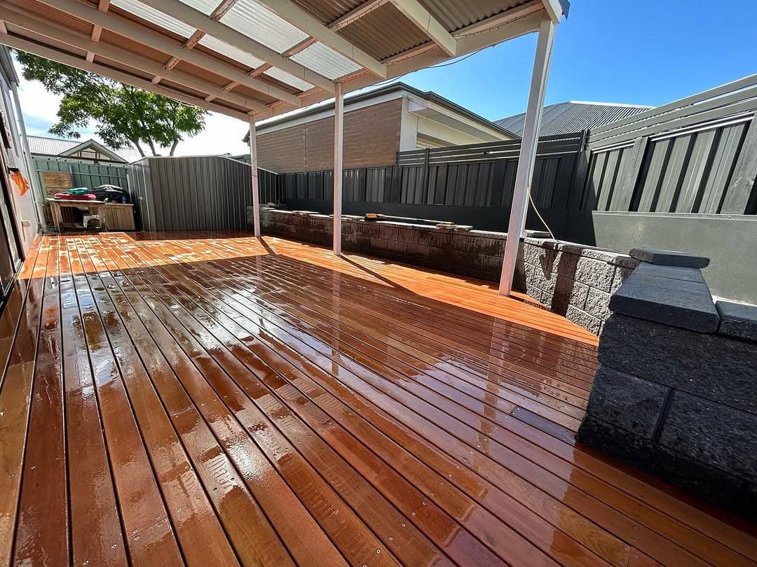 Freshly oiled merbau deck against dark cladding