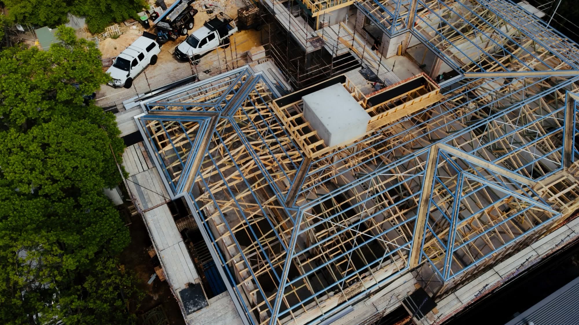 Aerial view of steel and timber roof framing across a two-storey Dulwich build