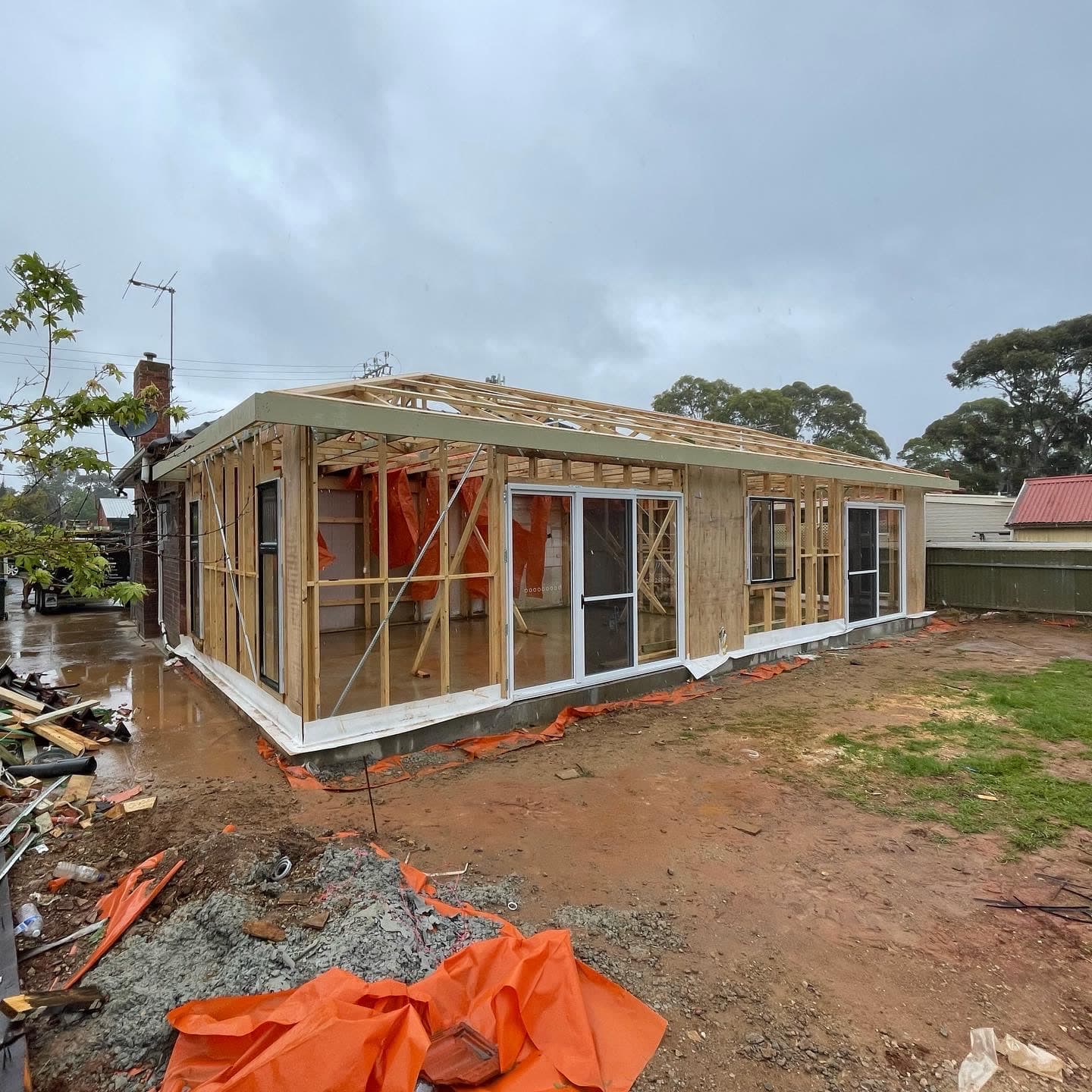 Rear extension framed and wrapped on a wet day