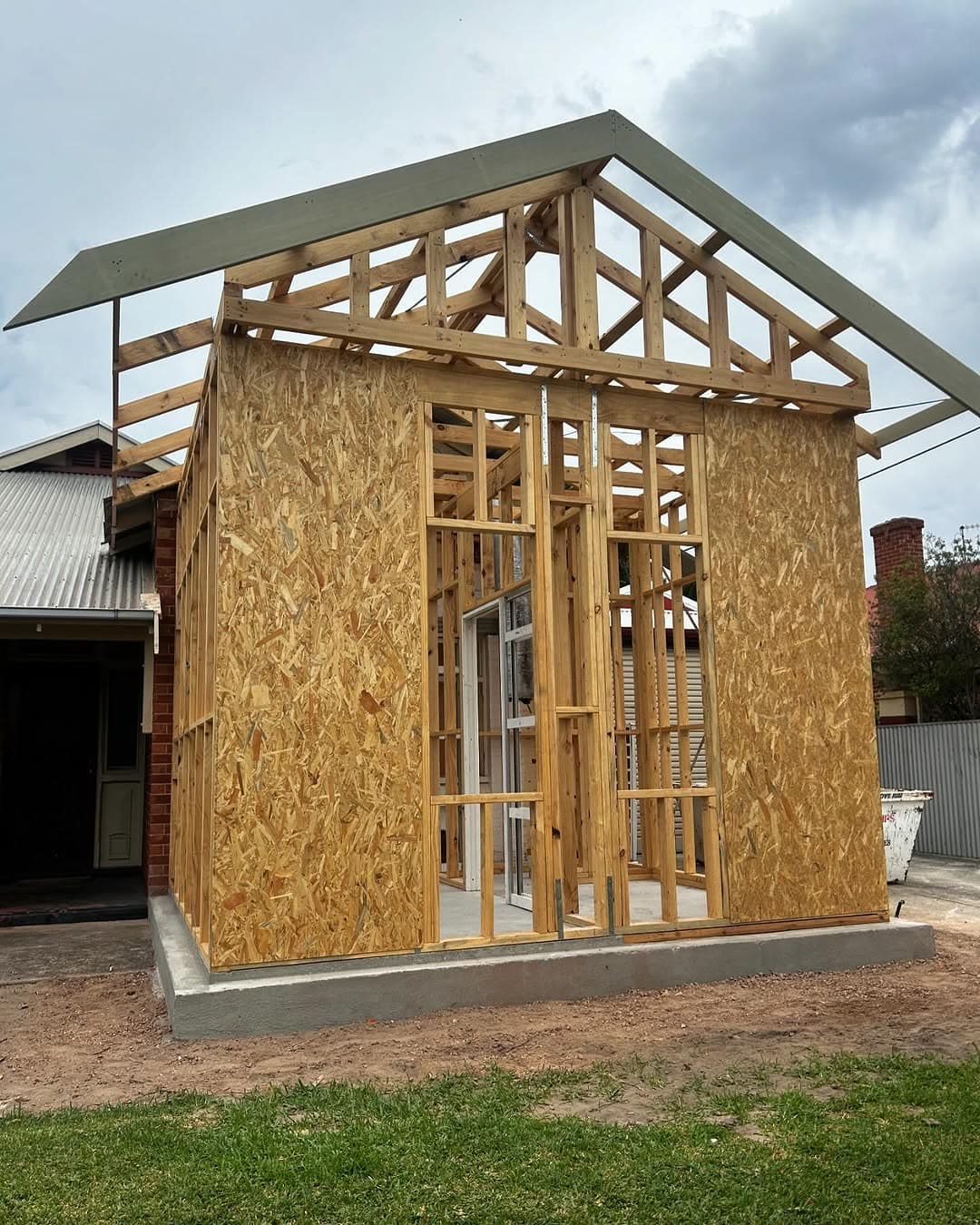 Stand-alone timber-framed studio with gable trusses