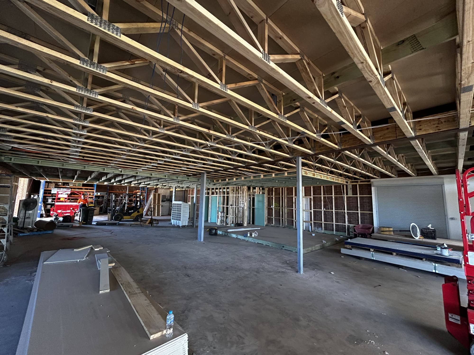 Suspended timber ceiling framing across a commercial tenancy